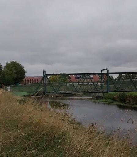 River Mersey weir, down stream, to the left was the site of the old mill and the bridge replaced the original ferry.