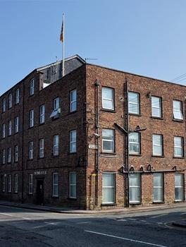 Oxford Road mills. A four storey wing on Oxford Road has the name J Dunkerly & Son Ltd who were silk manufacturers and throwsters in the late 19th century. Now used as offices.