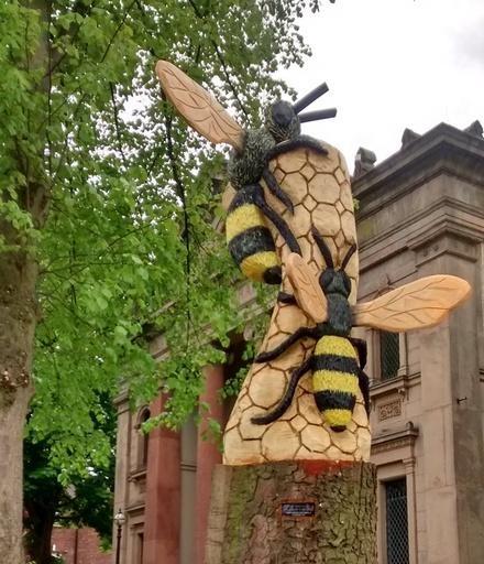Trinity Methodist Chapel, Northenden Road, a new addition April 2018 , Bees - a chain saw carving.