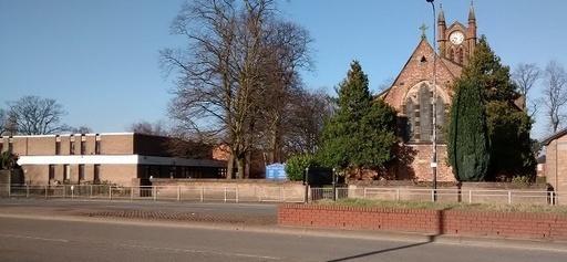 St Matthew's Parish Church, Stretford, with Community Hall on left hand side, seen from across Chester Road