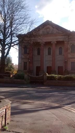 Trinity Methodist Chapel, Northenden Road, opened in 1875. The main chapel was sold in 1980. The modern extension, at the rear, is now used as the Methodist Church and Hall.