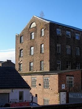 Crompton Road mill, Crompton Road. A silk weaving and cotton spinning mill built c1825 with late C19 additions.