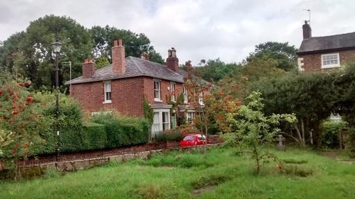 Old centre of Northenden - St Wilfrid's churchyard with entrance from the Old Rectory.