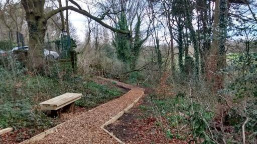 Rose Hill woods with improved pathways and a view of Didsbury golf course through the trees. Rose Hill House is now private apartments but Rose Hill Woods are open to the public.